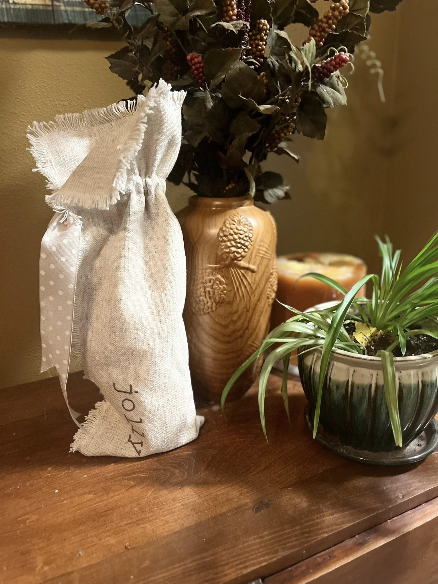 Hand-painted lighted bottles and cookie mix jars